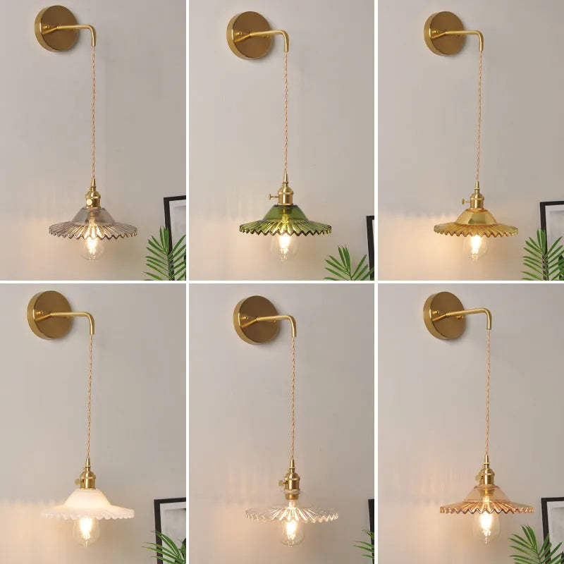 Retro brass lotus wall lamp with copper frame and glass shade on a wall
