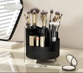Rotating cosmetics storage box with two shelves holding makeup brushes and beauty products
