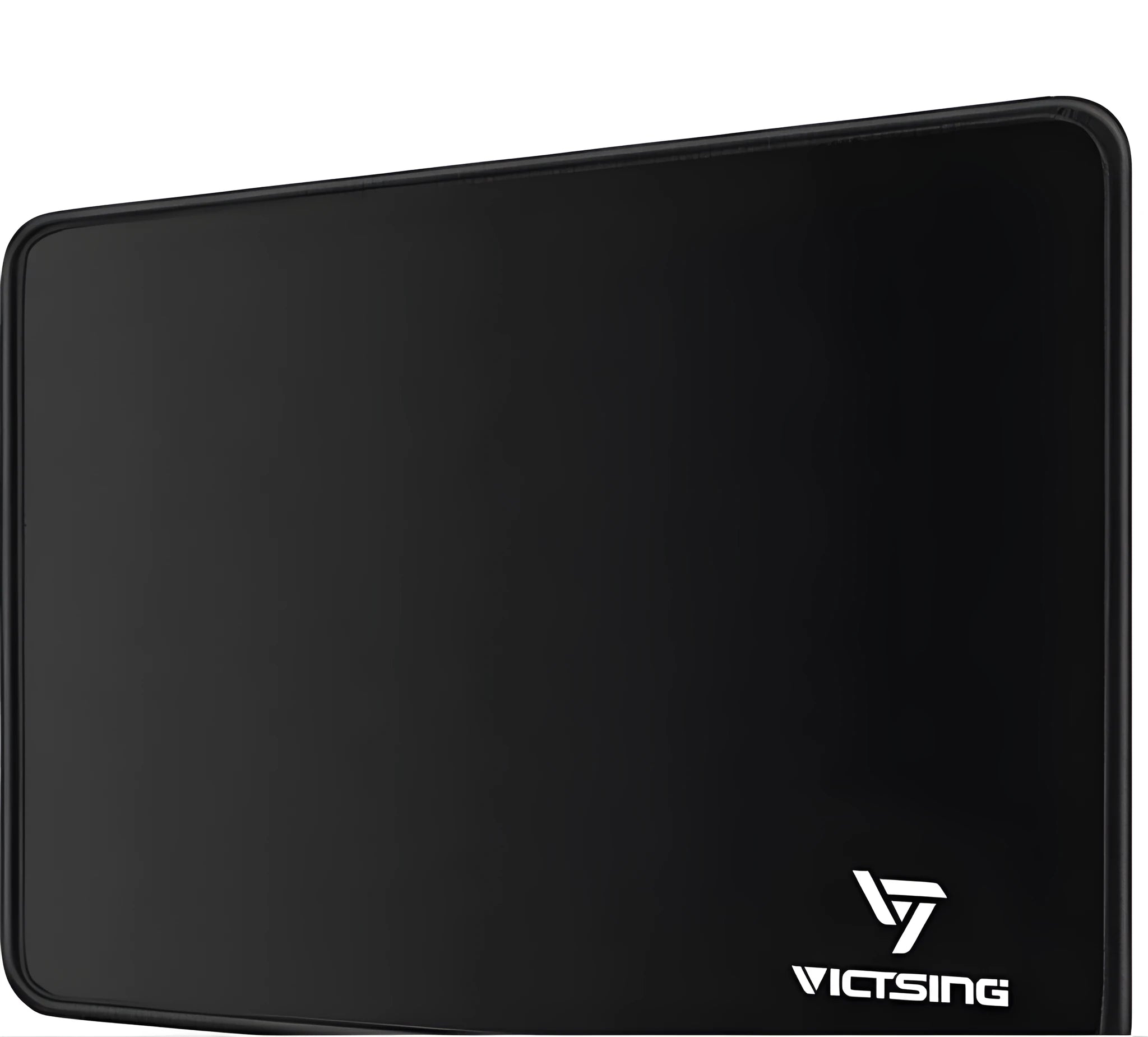 Black rectangular rubber gaming mouse pad on a wooden desk