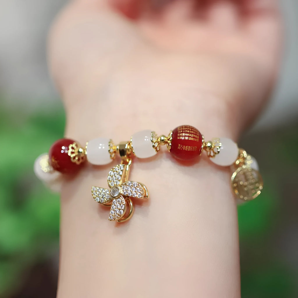 Chinese style women's coloured glass bracelet with safety lock and windmill charms