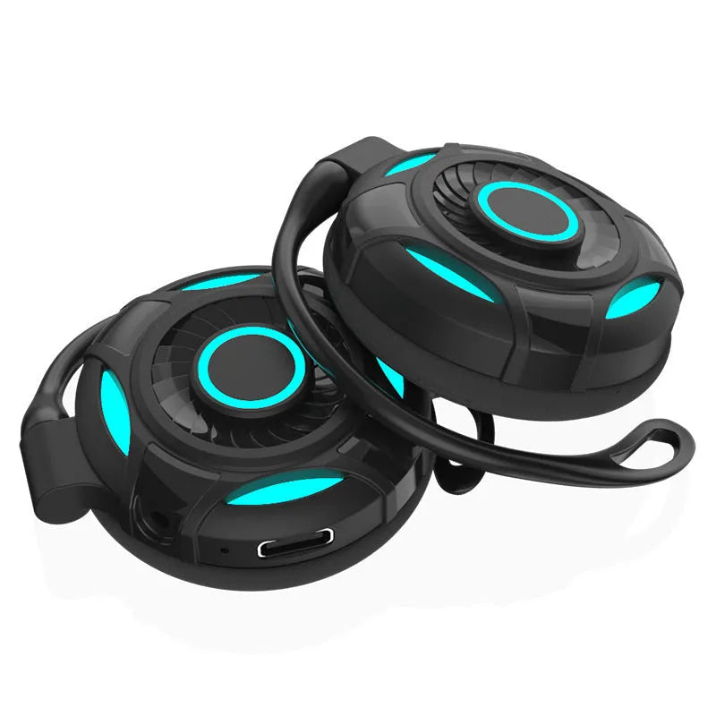 Black and white Bluetooth gaming earphones with hanging ear design and USB charging cable