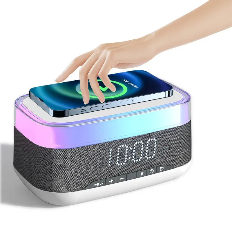 White multifunctional alarm clock with Bluetooth speaker, wireless charging pad, and night light display