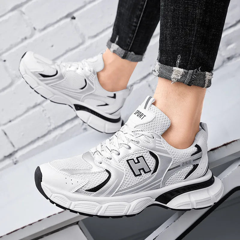 Men's mesh running shoes in black, white and grey, and white orange colours with plastic soles