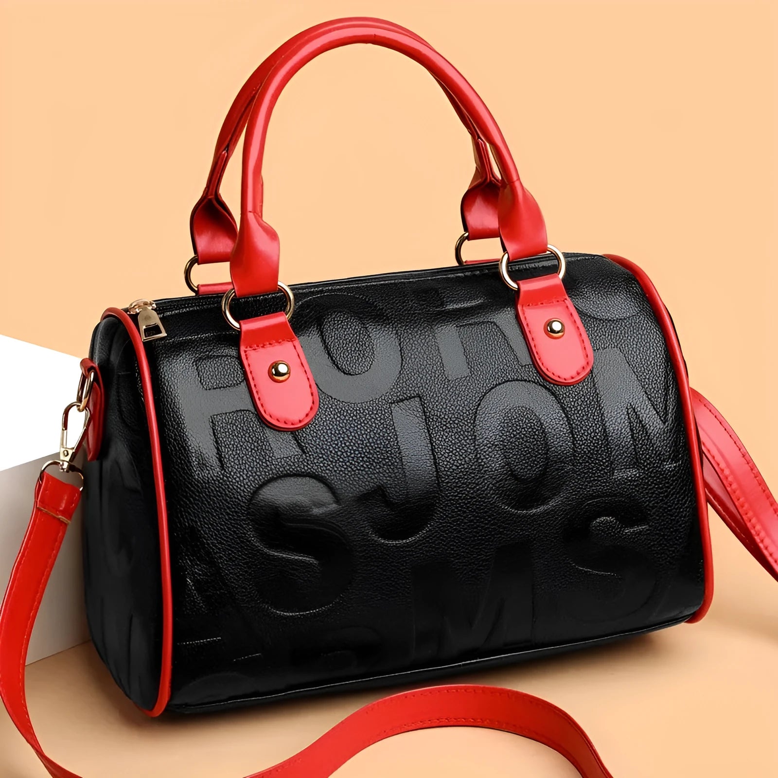 Cylindrical PU crossbody bag with three shoulder straps in red or brown colour with polyester lining