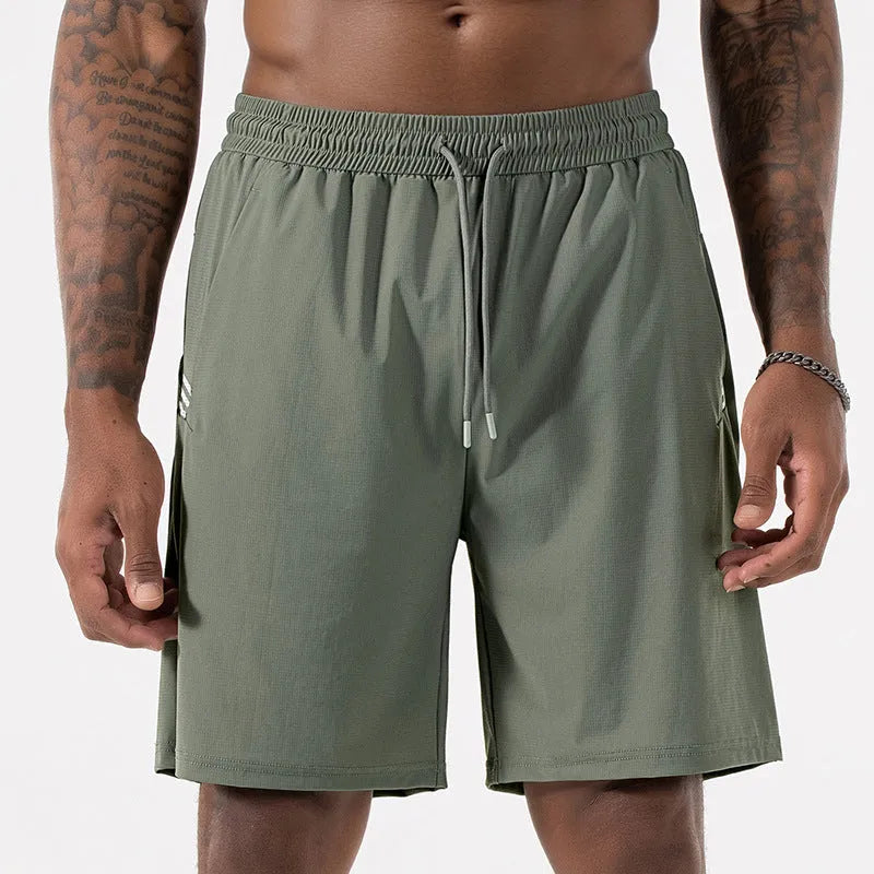 Man wearing black ice silk sport shorts with a high waist and cropped length.