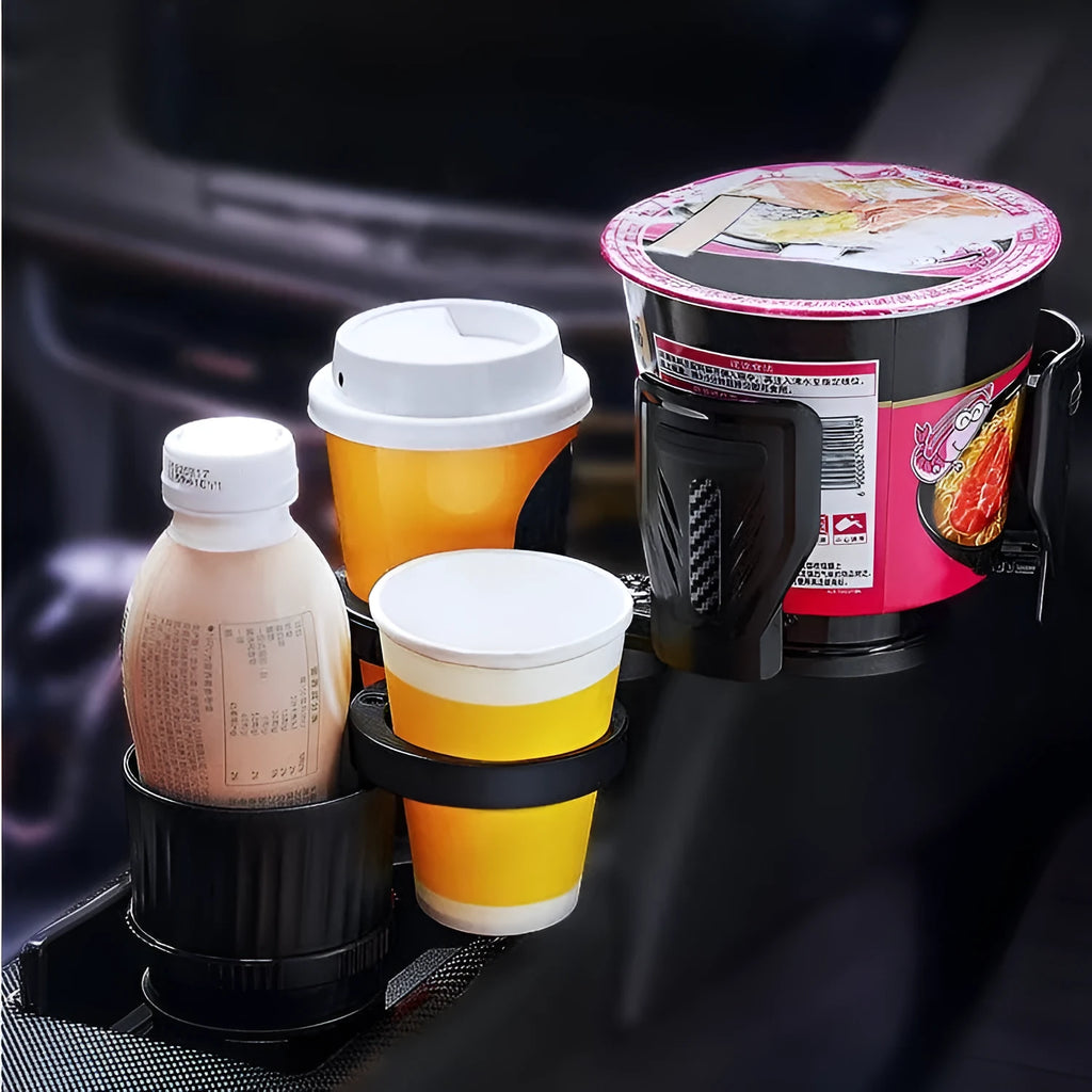 Black retractable car cup holder with adjustable base on a car dashboard.