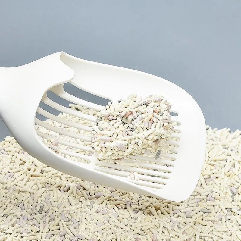 White plastic cat litter scoop with base tray measuring 29.5cm