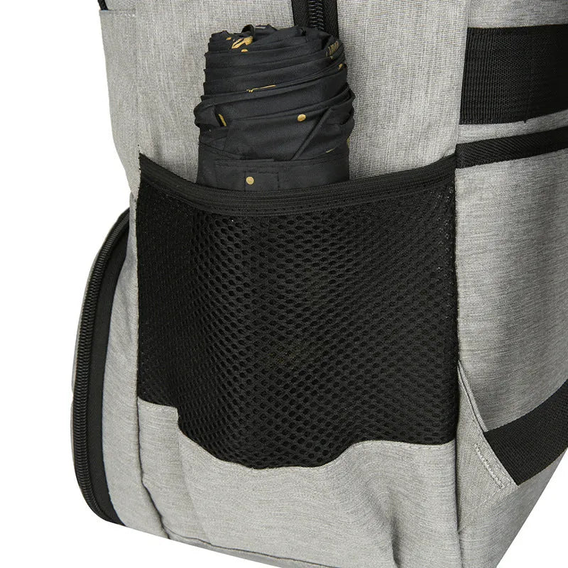 Light grey Oxford cloth insulated backpack with curved shoulder straps and a pull rod belt attached.