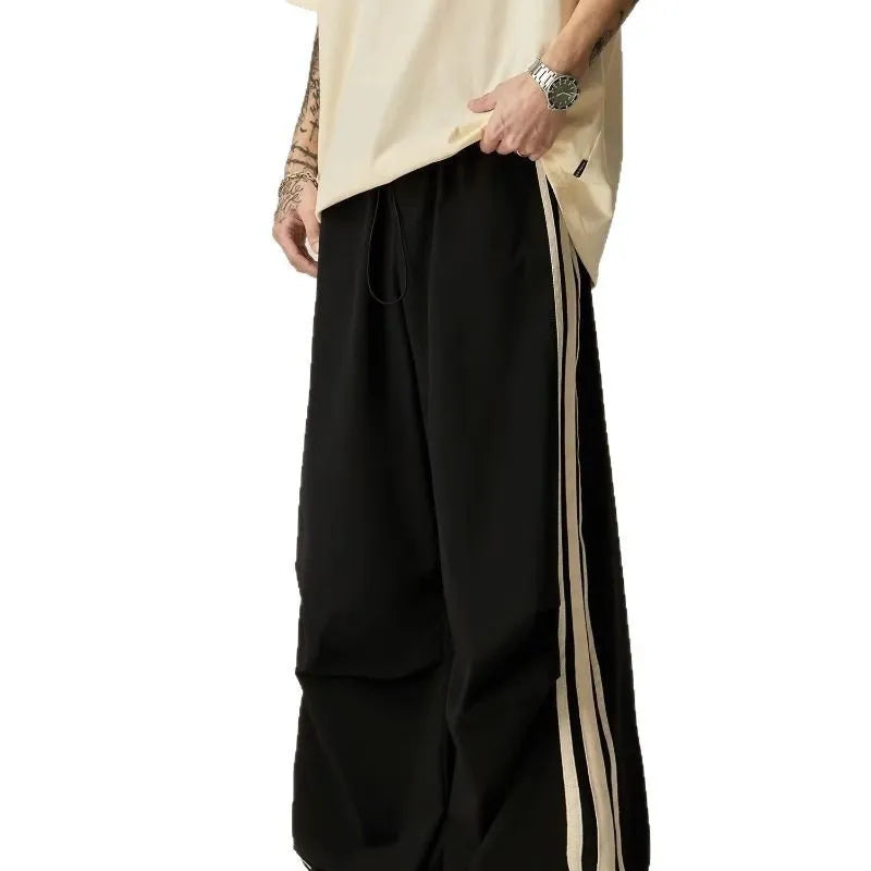 Black men's wide leg high-waist trousers with a straight-leg cut for summer casual wear.