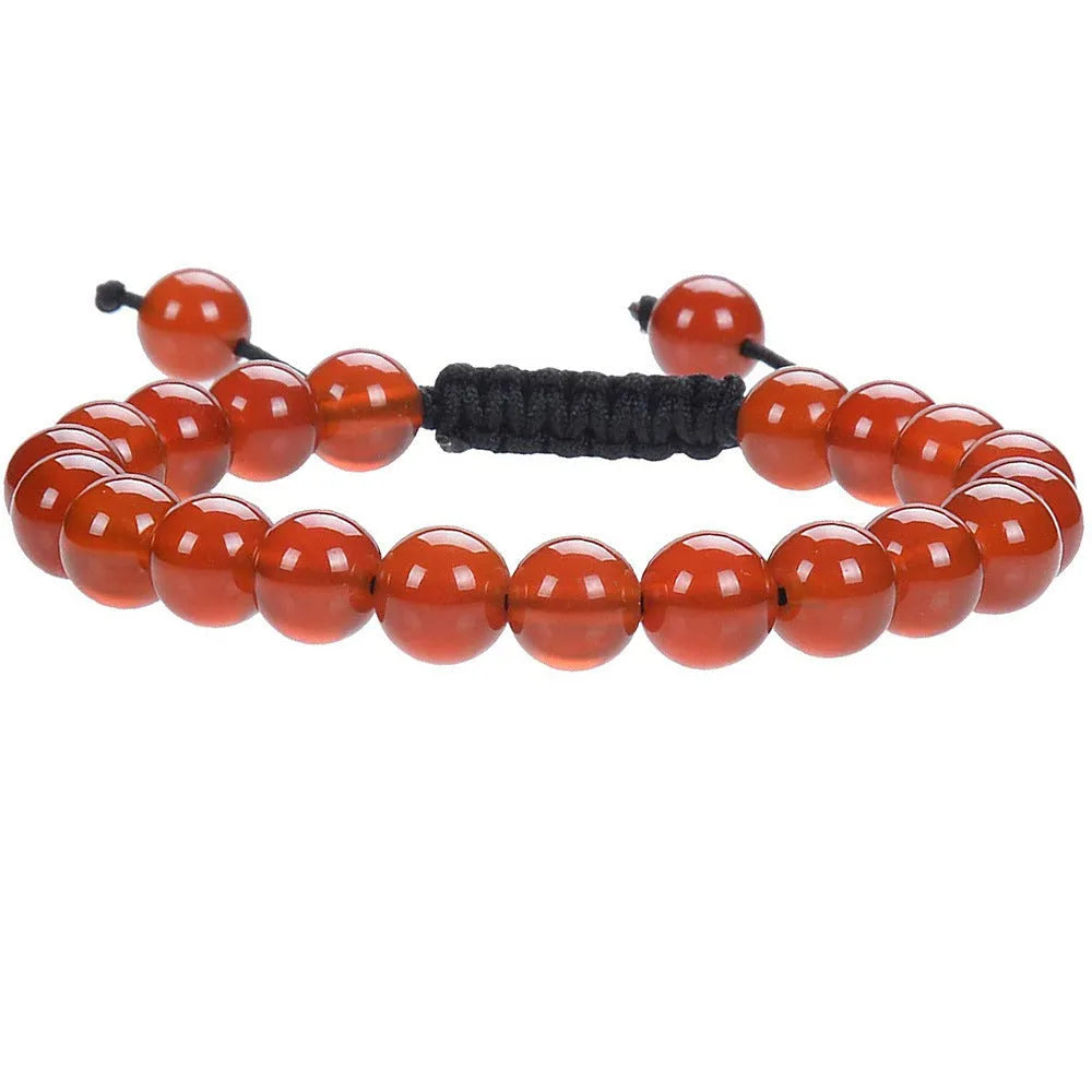 Women's flat knot braided bracelet hand-woven from aquamarine stone with geometric patterns.