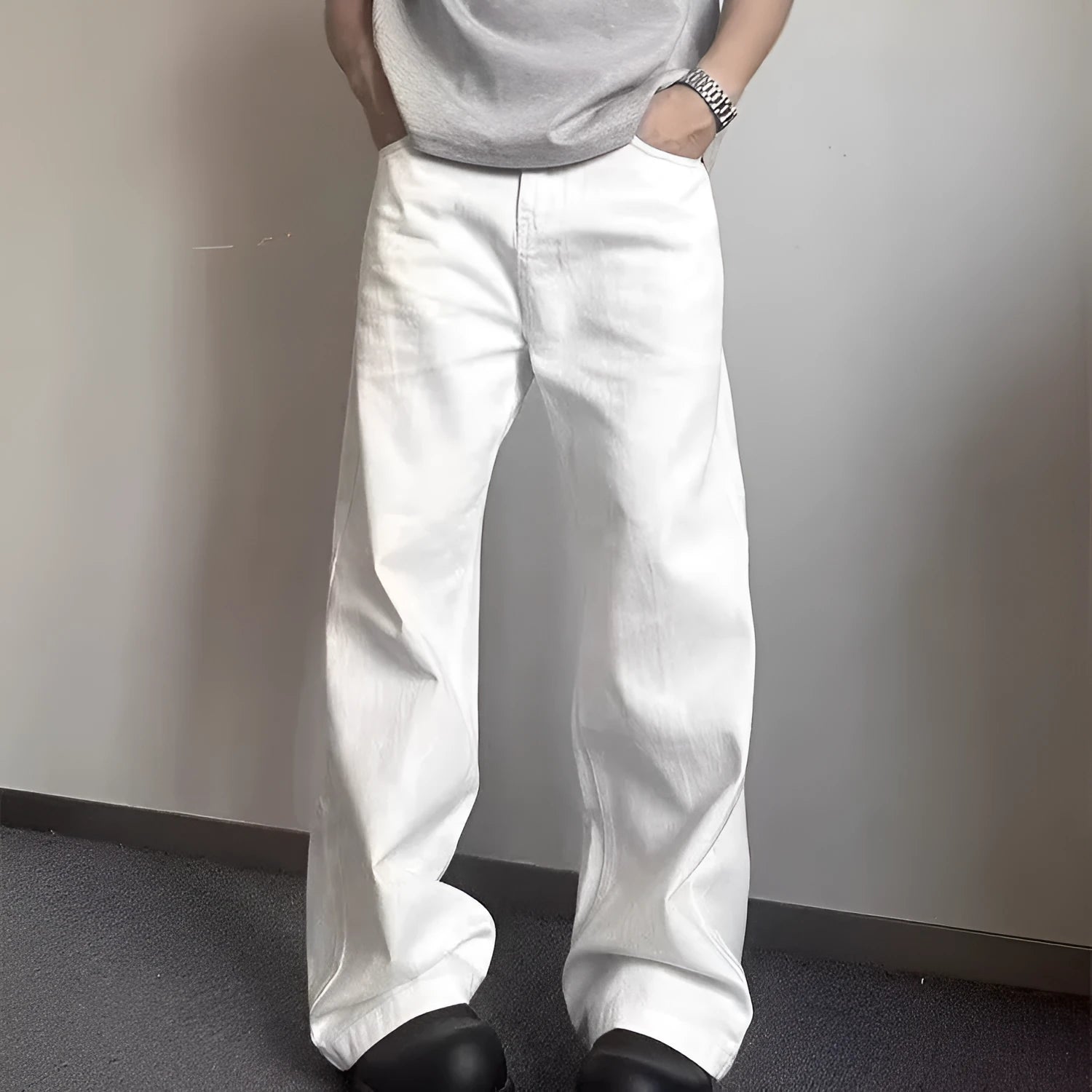 Men's white straight-leg cotton denim jeans on a neutral background.