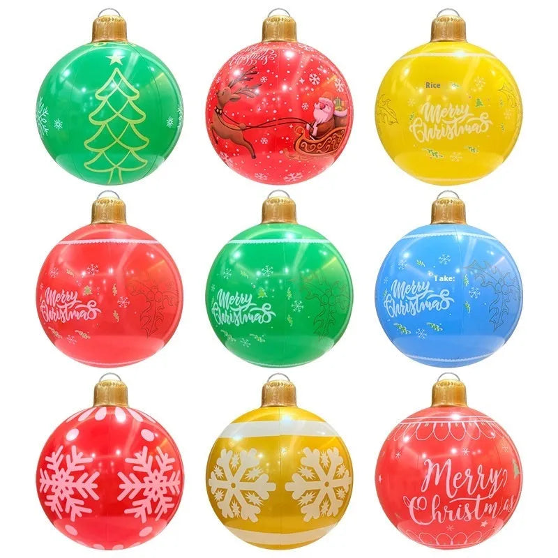 Large red inflatable Christmas ball with flashing lights in garden setting