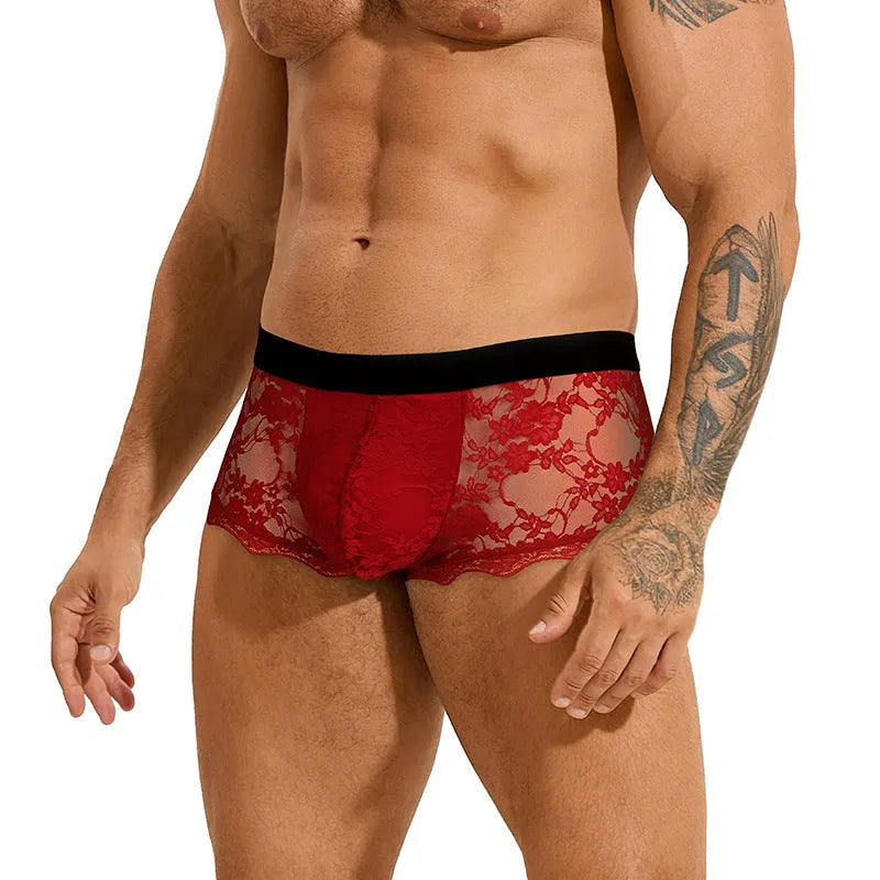 Men's black lace briefs with a hollow-out, see-through pattern laid flat.