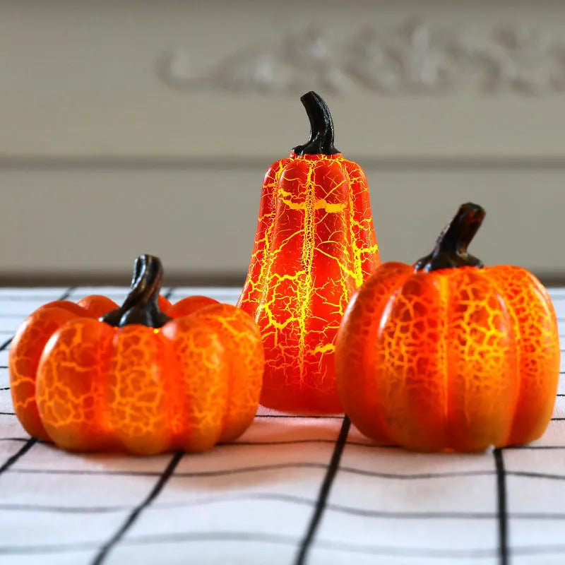 Three Halloween pumpkin lanterns in short, medium, and long sizes with LED illumination and realistic surface cracks