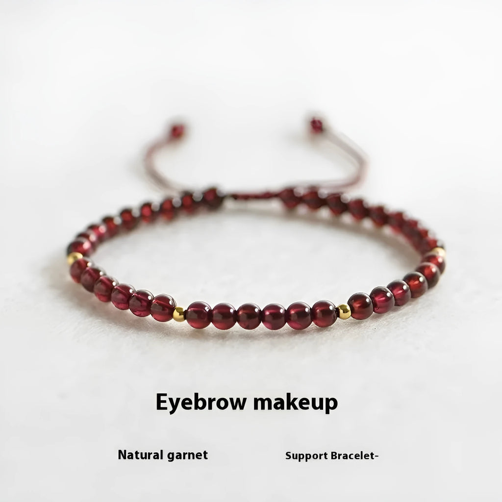 Hand-woven red rope garnet bracelet on a wrist, showing flexible wire and new Chinese style.