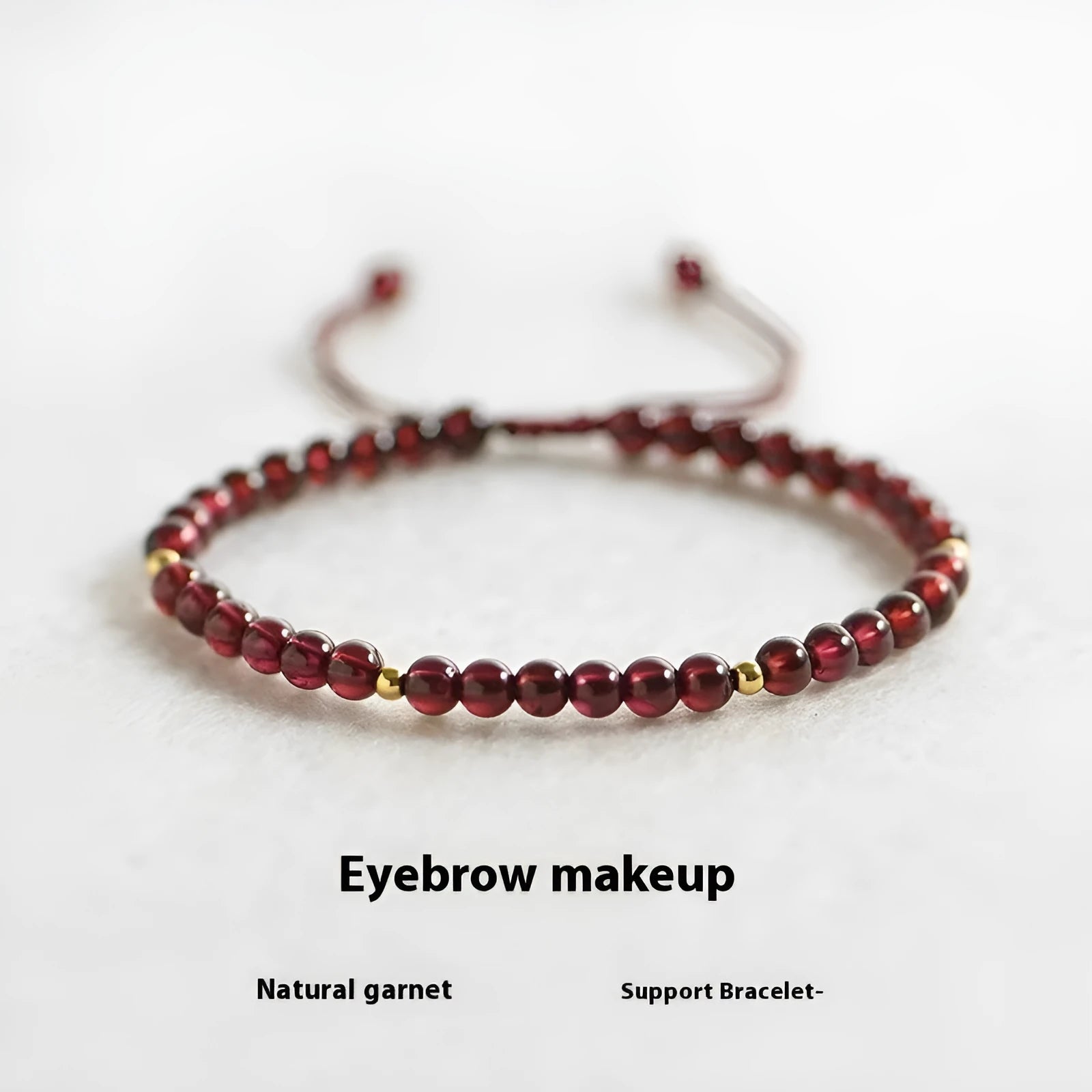 Hand-woven red rope garnet bracelet on a wrist, showing flexible wire and new Chinese style.
