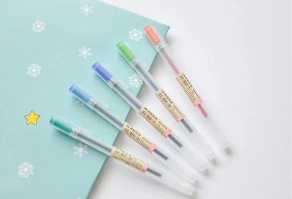Muji 12-piece gel pen set with black ink, showing fine 0.5mm nibs.
