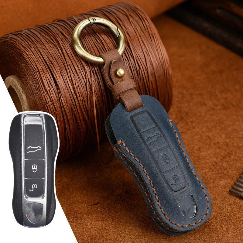 Genuine cowhide leather Porsche key cover with a retro bag buckle in blue and brown colour options.