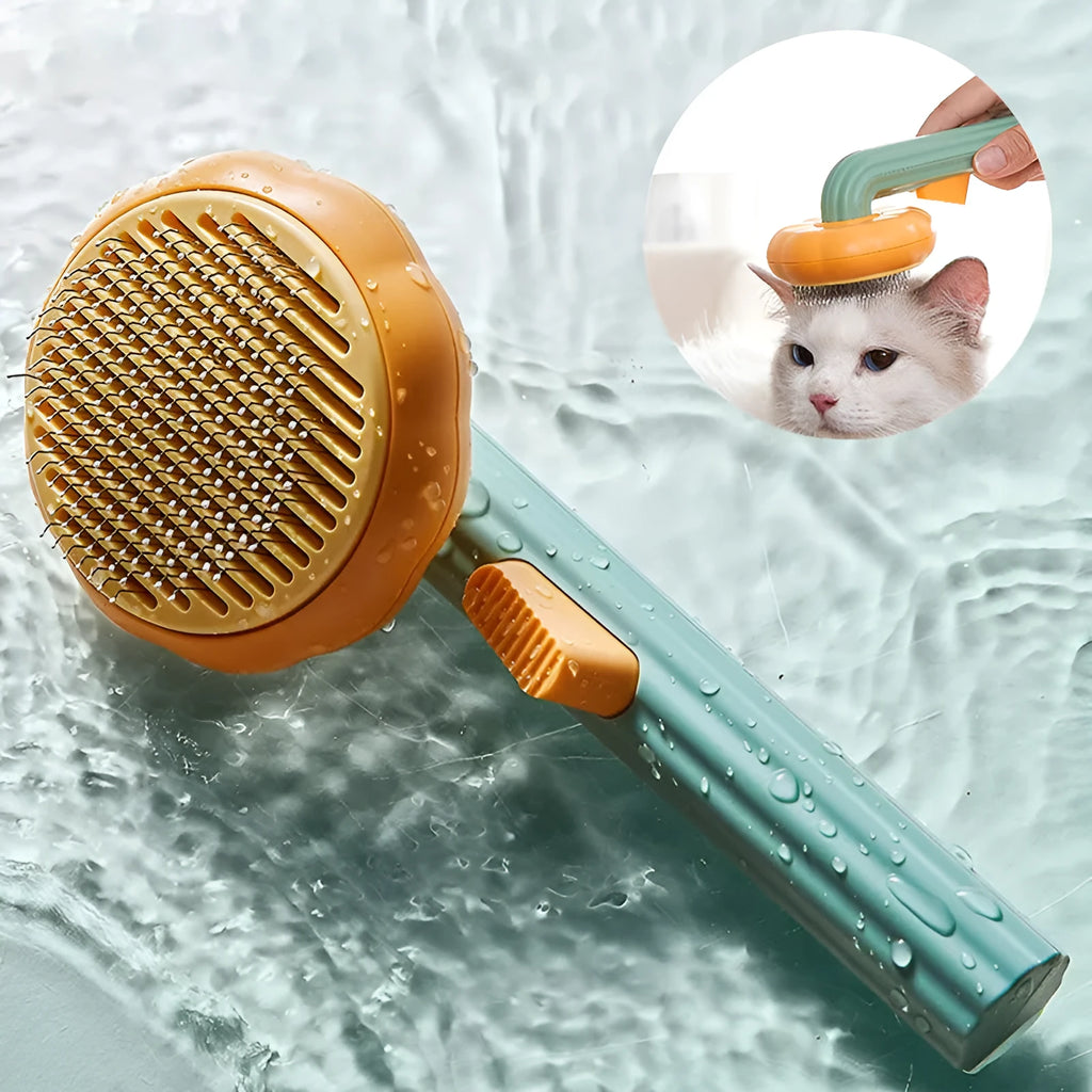 Hand holding a white and pumpkin coloured pet grooming brush with many stainless steel needles.