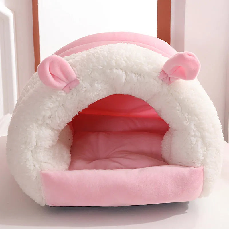 Blue closed hooded cat nest bed showing padded interior and washable cover.