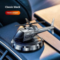 Silver solar-powered metal helicopter car air freshener with rotating blades on a dashboard.