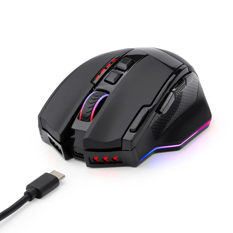 Redragon M801P black wireless gaming mouse with multiple side buttons on a desk.