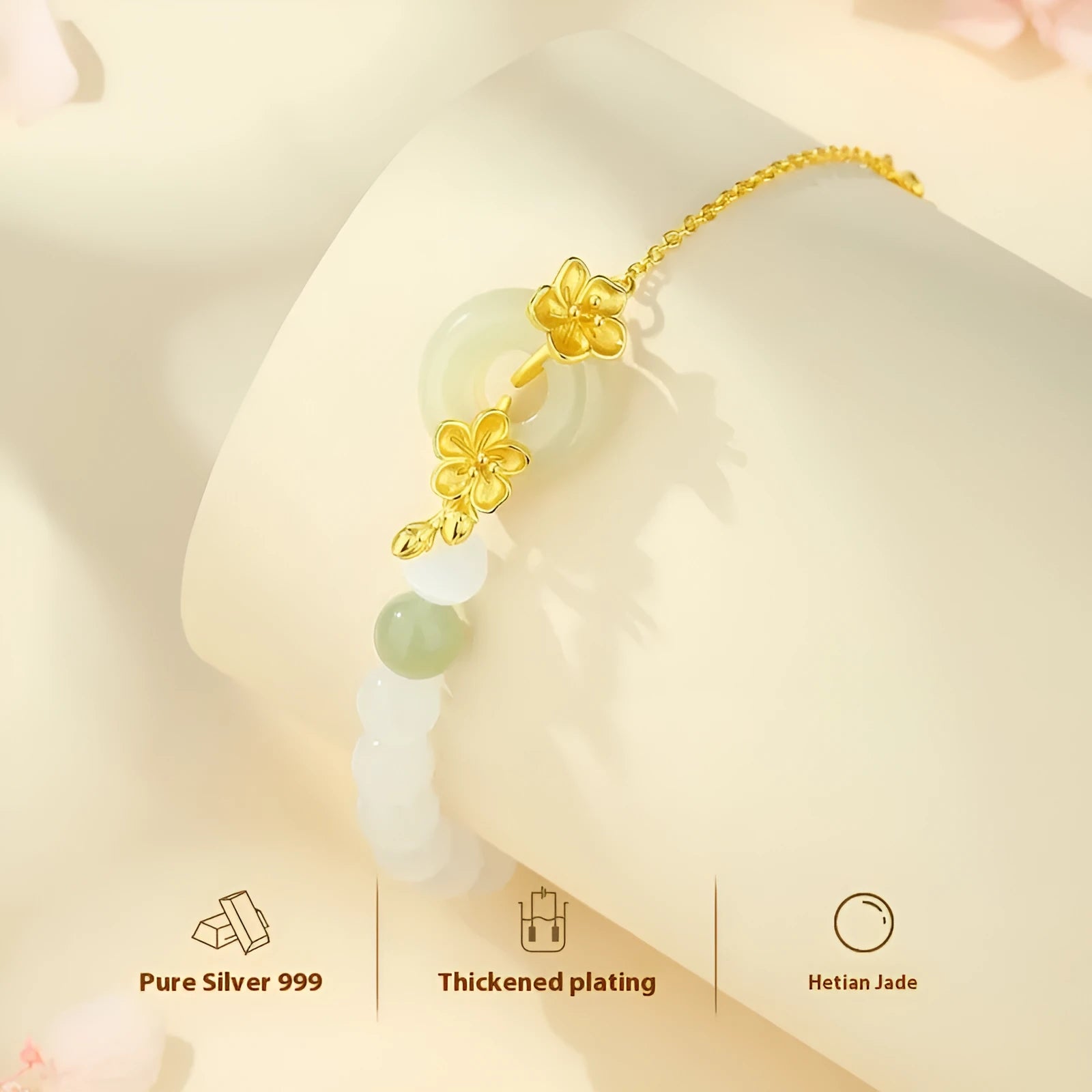 Women's pure silver bracelet with a safety buckle and a peach blossom flower charm in a choice of gold colours.