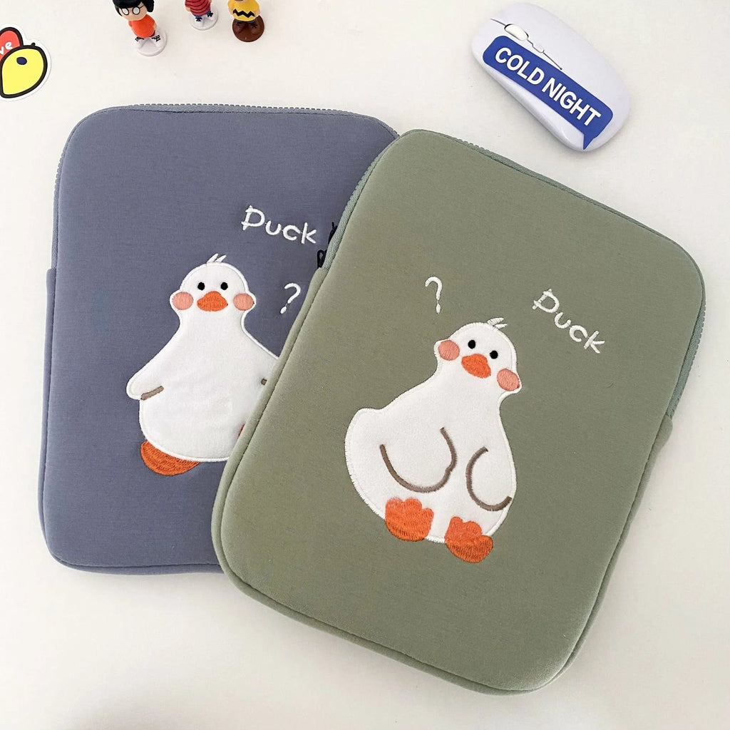 Blue cotton tablet case with embroidered cartoon duck design and a zip closure.