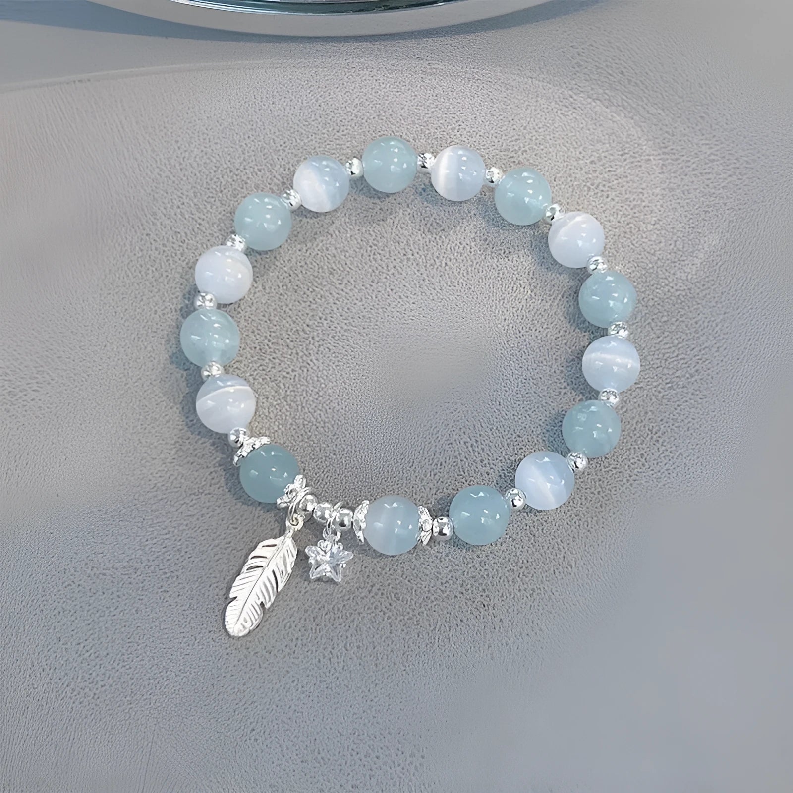 Glass crystal bracelet with coloured glaze in blue moonlight colour showing text modelling and eight-point star detail