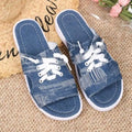 Blue women's flat canvas Roman slippers with a cloth upper and rubber sole.