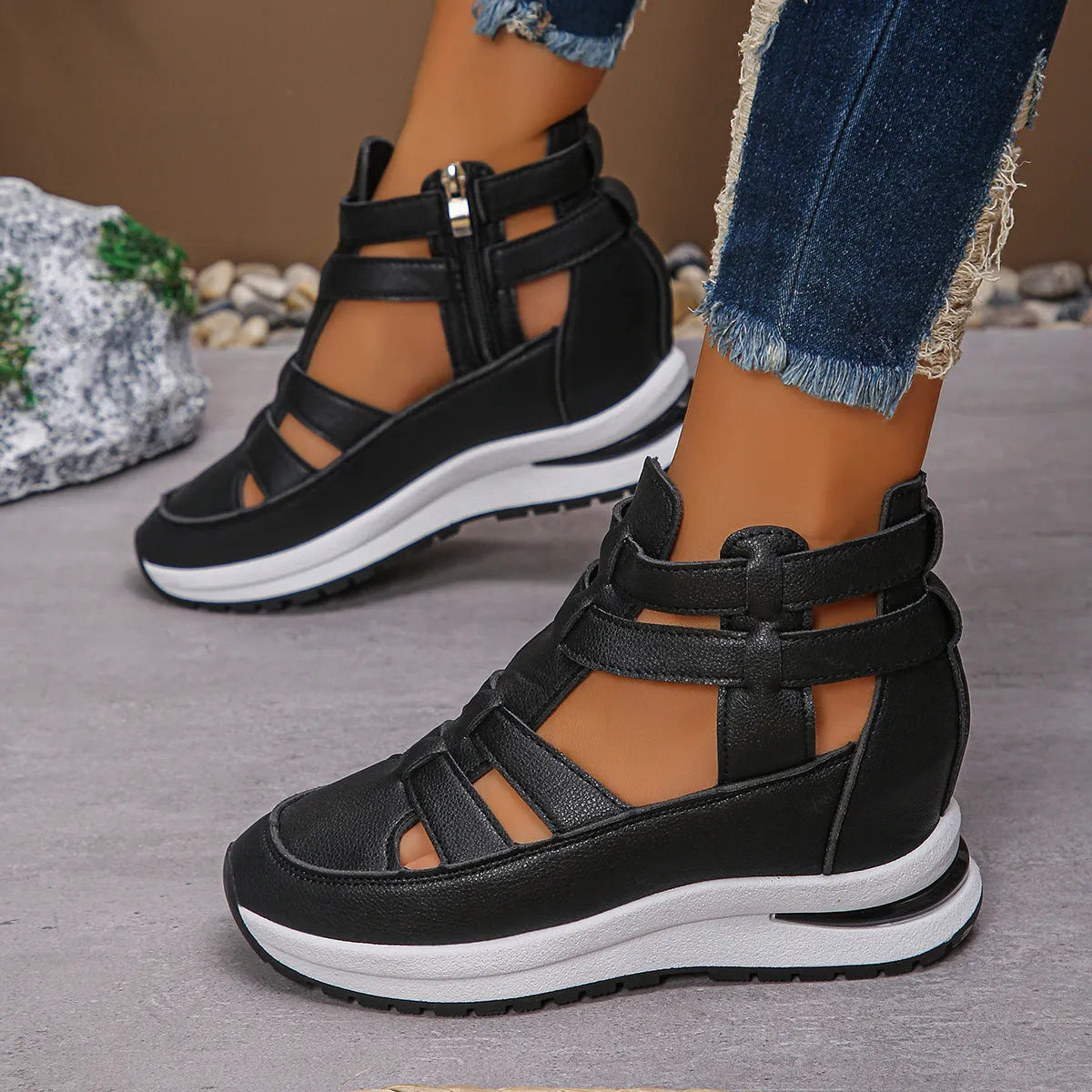 Black women's close-toed platform sandals with hollow-out design and Velcro strap on a white background.