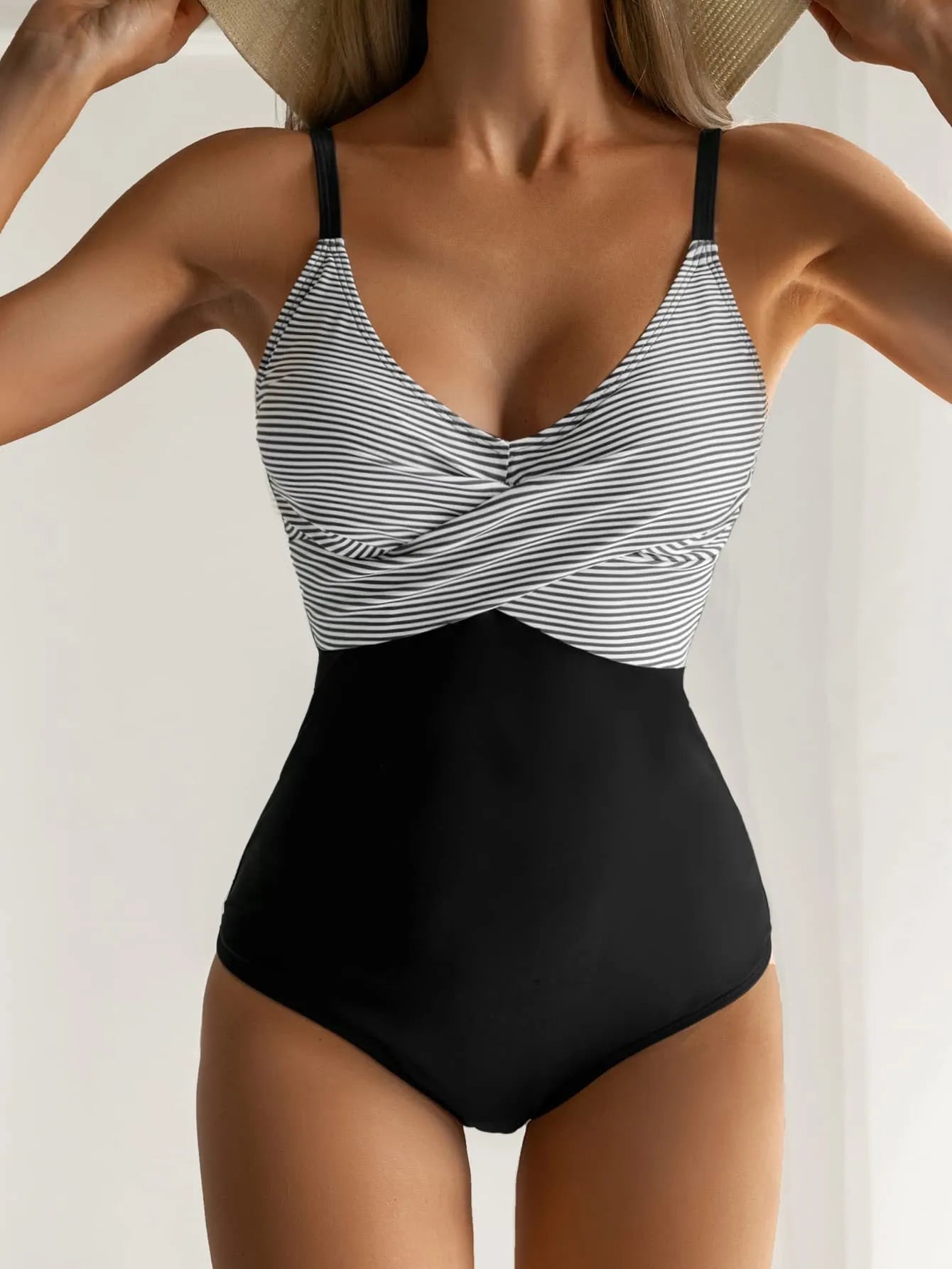 Women's printed one-piece bikini swimsuit with lace-up back in a floral pattern.
