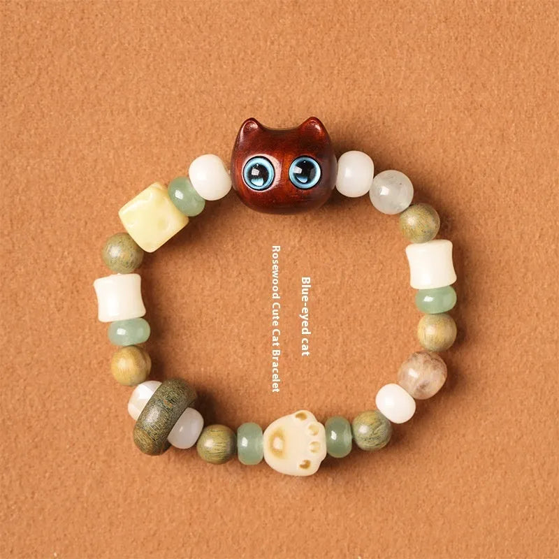 Hand-woven bracelet with jade guajacwood multi-treasure cube and cat's paw design in bodhi and ebony materials