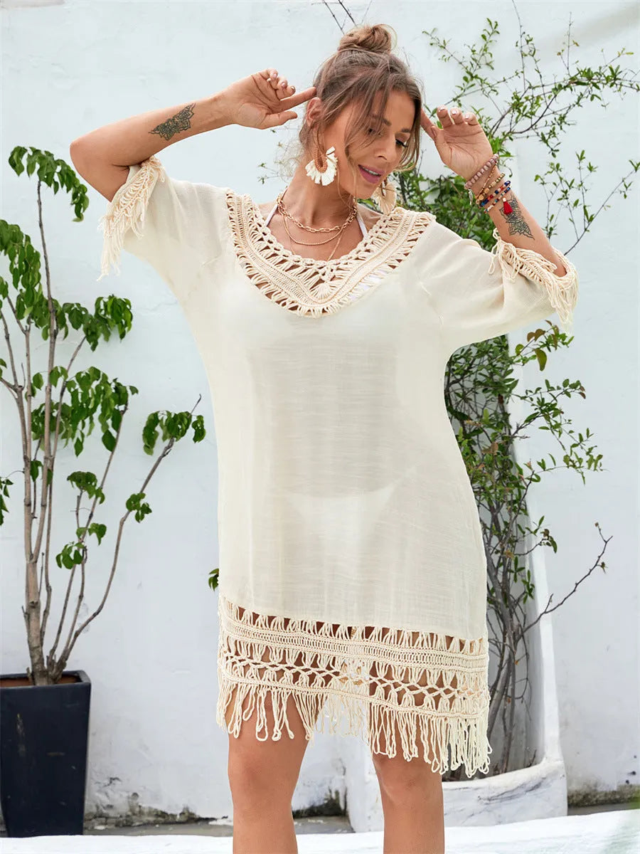 Apricot coloured hand-crocheted women's long beach dress with a solid lining.