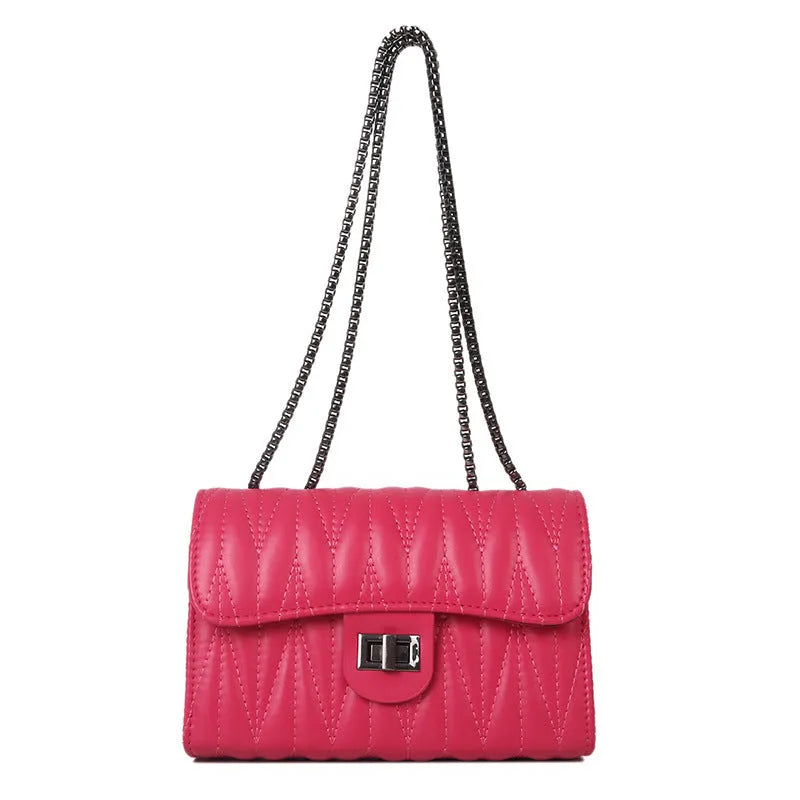 Small textured diamond pattern PU crossbody bag in multiple colours showing front slit pocket.
