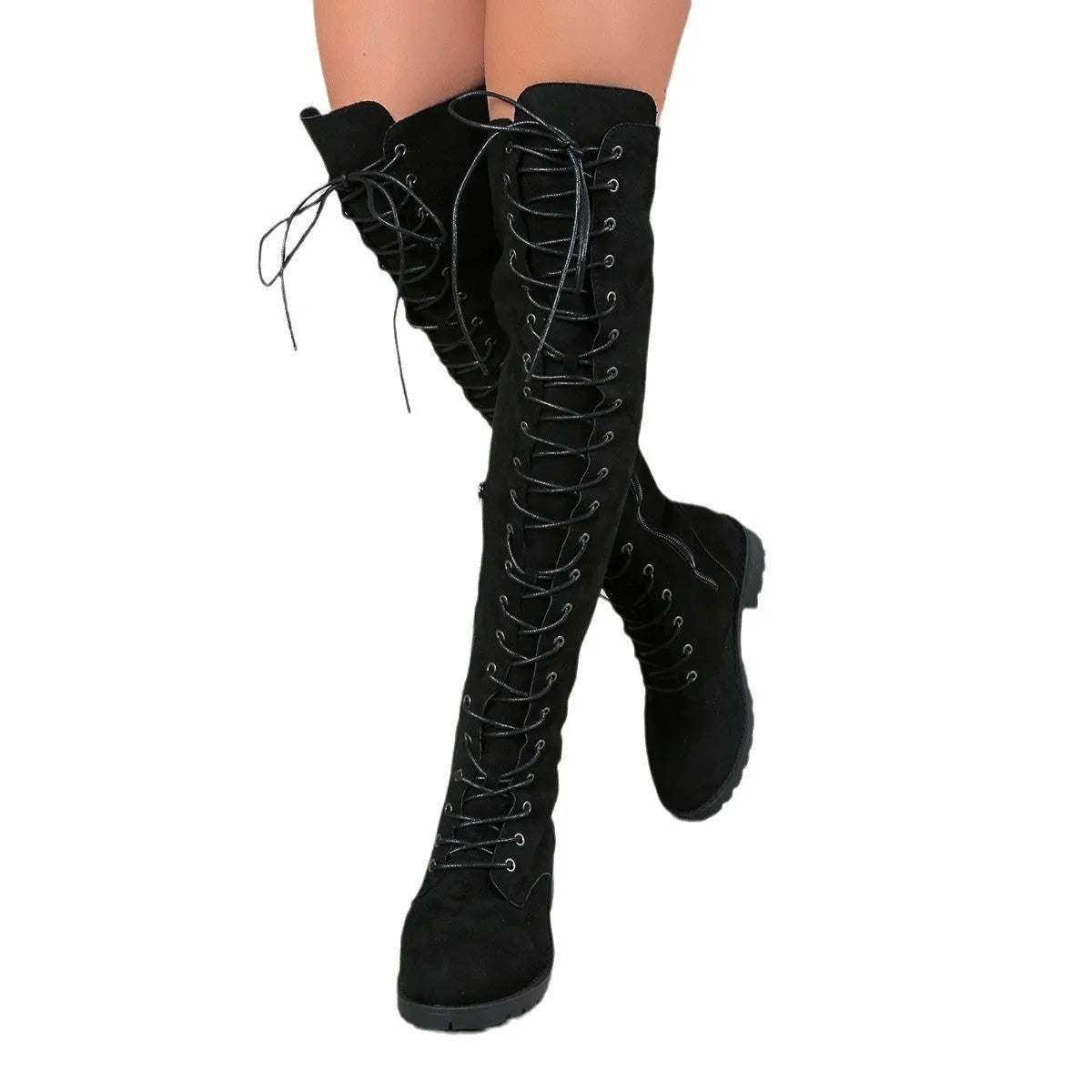 Black lace-up over-the-knee flat boots with a round toe, shown on a model.