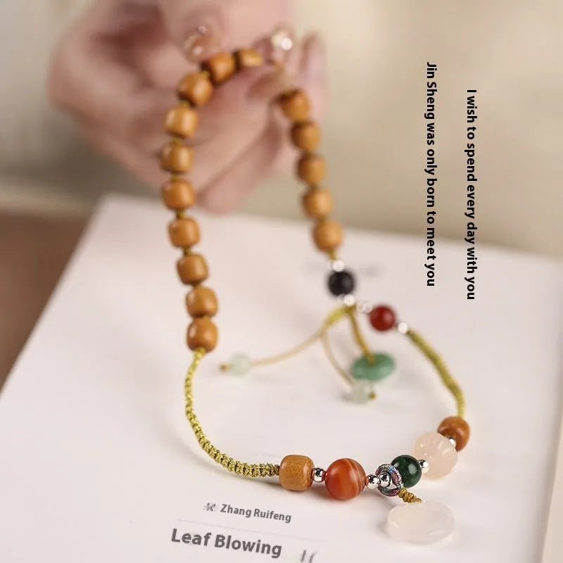 Hand-woven women's ebony bracelet with sandalwood fragrance and traditional double ring design