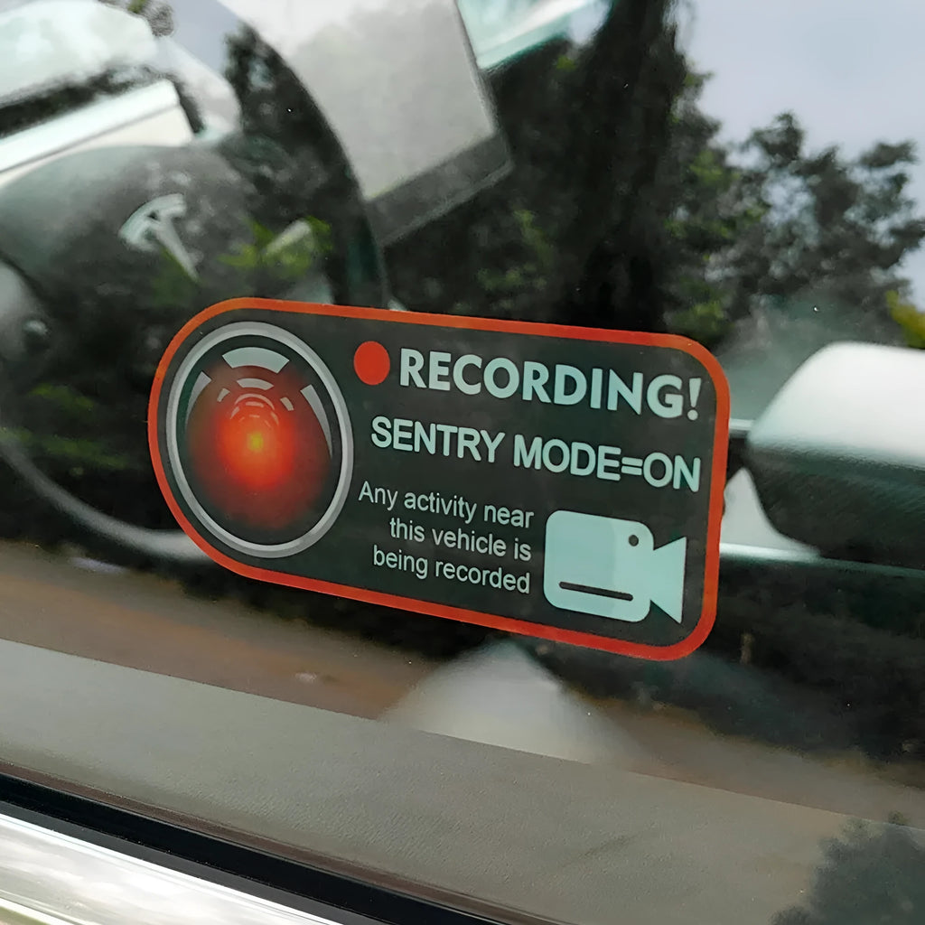 Pair of Tesla Sentry Mode warning stickers showing English text on PVC material