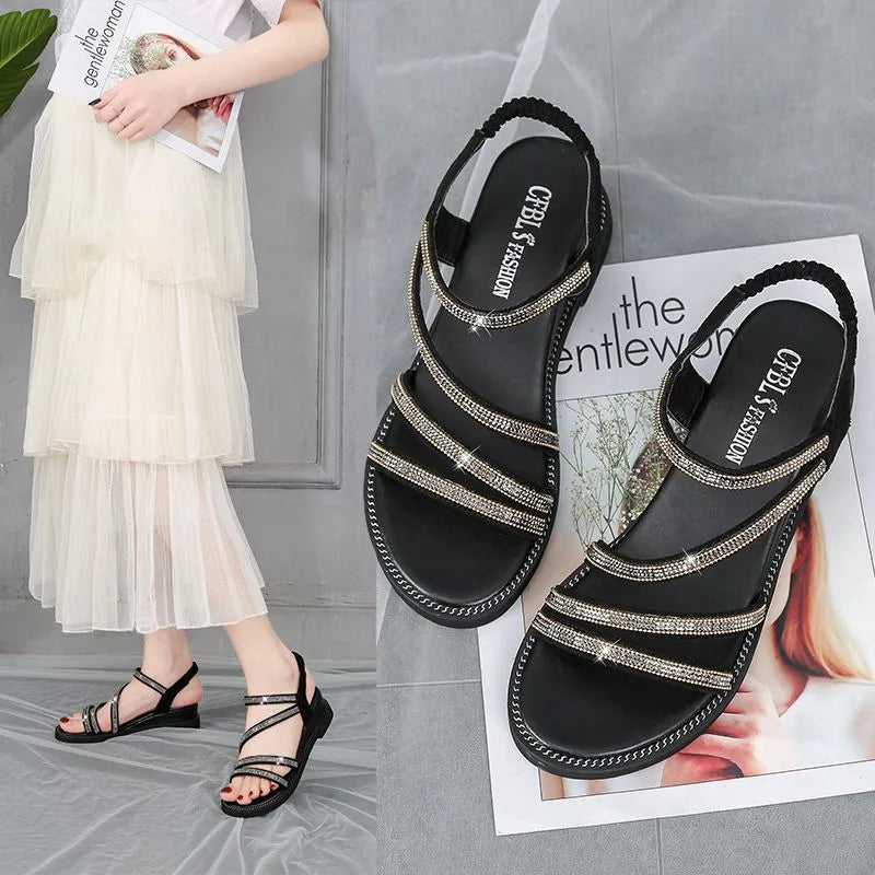 Women's silver casual sandals with round toe, rhinestone details, elastic band, and flat rubber sole.