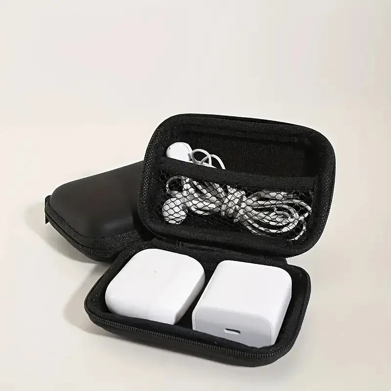 Compact black EVA travel storage box for headset cables, size 11x7.5x4 cm, on a neutral background.
