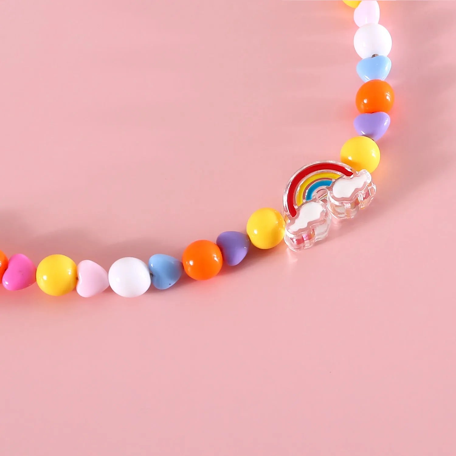 Colourful plastic bead pet necklace in peach, rainbow or small flower pattern with adjustable XS or S size options.