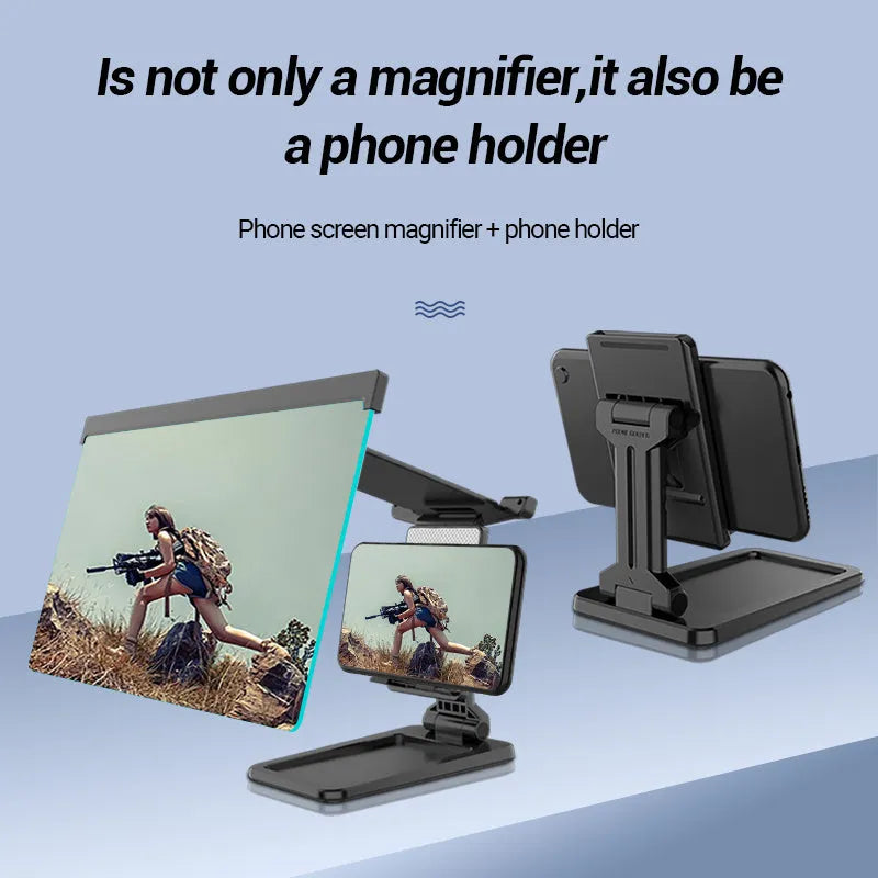 Black foldable mobile phone screen magnifier with a detachable phone holder on a desk.