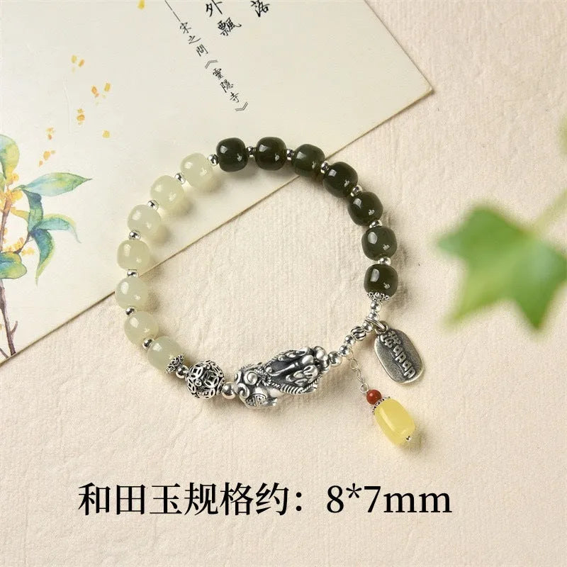 Retro-style pure silver bracelet for women with natural Hetian jade bead pendants.