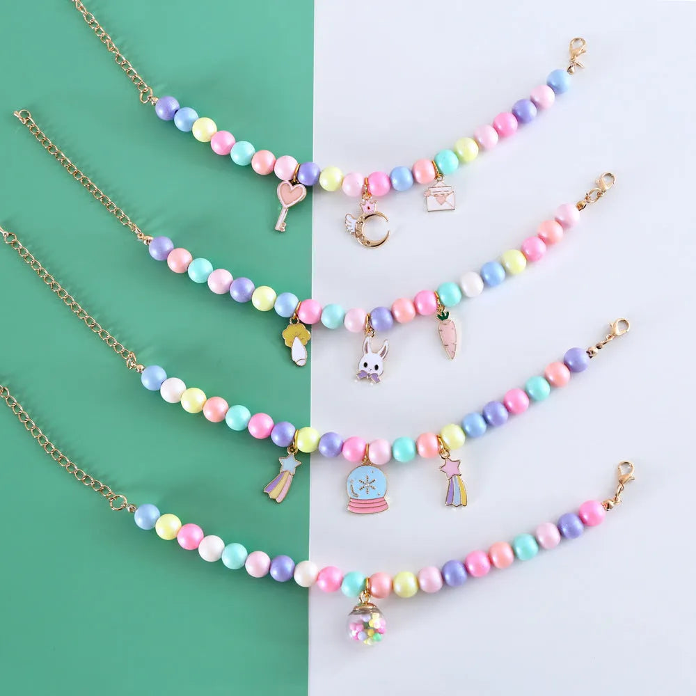 Colourful resin pearl collar and bracelet set for a small dog, shown in a macaron colour option.