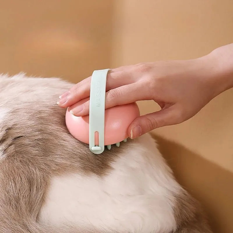 Blue silicone pet bathing brush with soft bristles for massaging and scrubbing cats and dogs.
