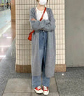 Women's khaki knitted V-neck cardigan with long sleeves, shown on a model.