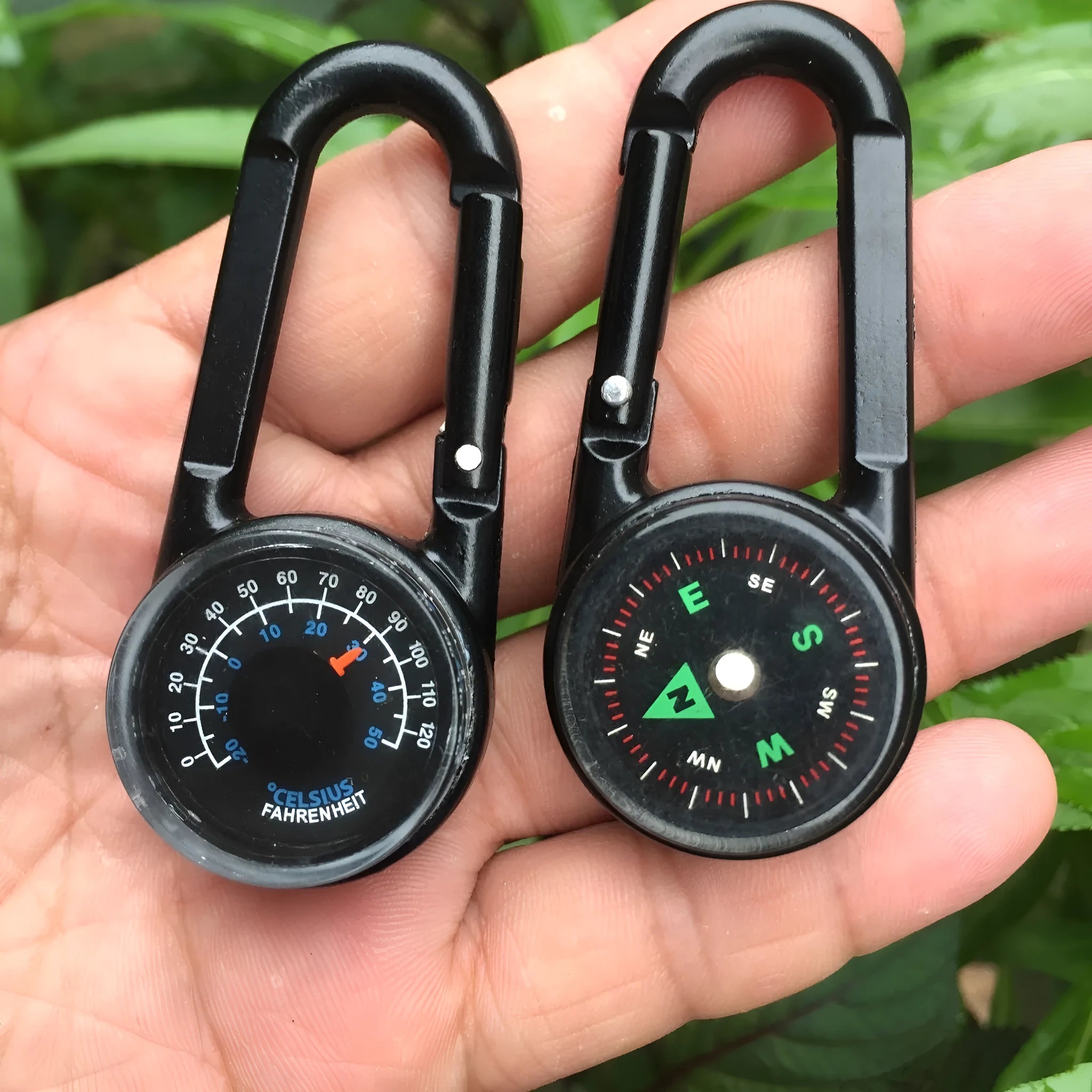Black zinc alloy carabiner with built-in circular compass and rectangular thermometer display.