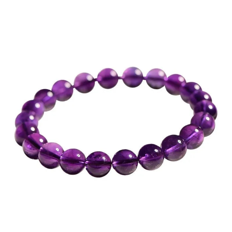 Natural Uruguayan amethyst crystal bead bracelet with polished scattered beads on a white background.