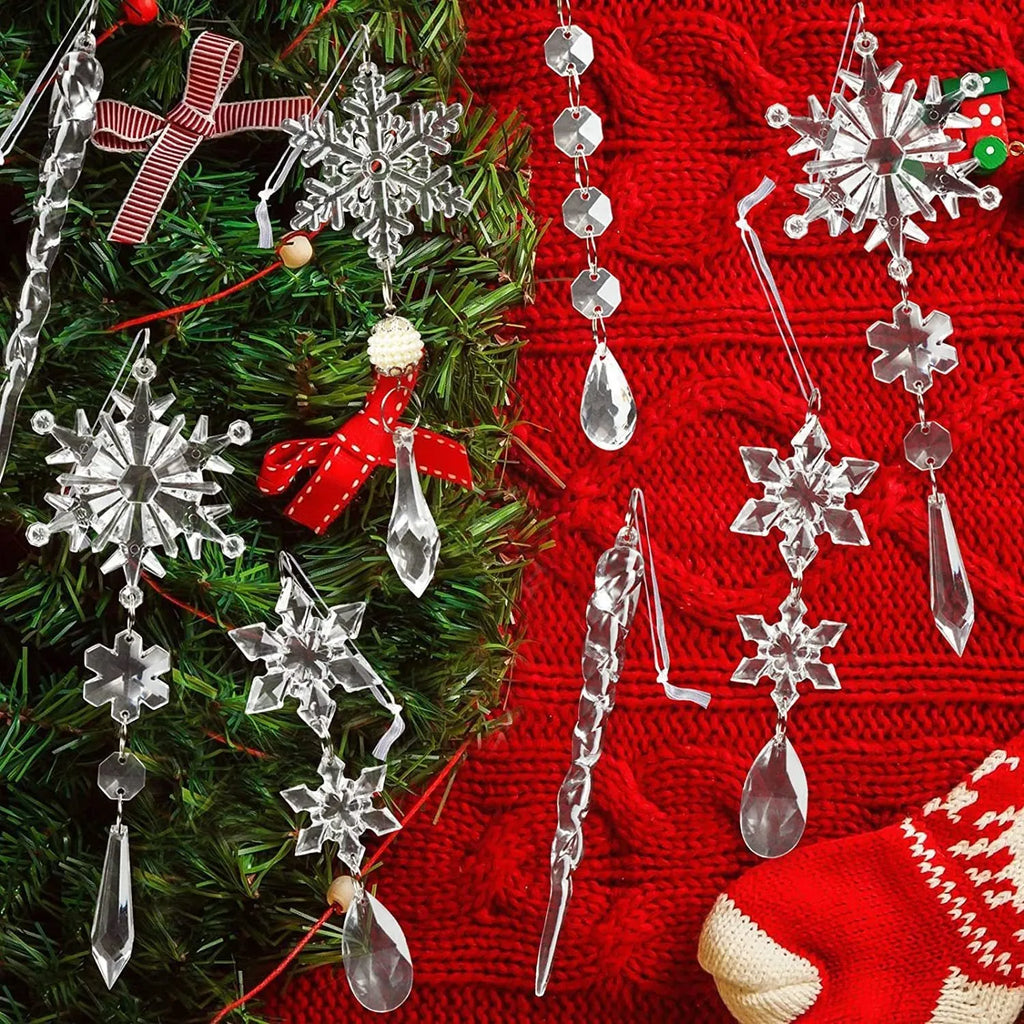 Ten clear transparent acrylic ice cone Christmas tree ornaments with white ribbons on green branches.