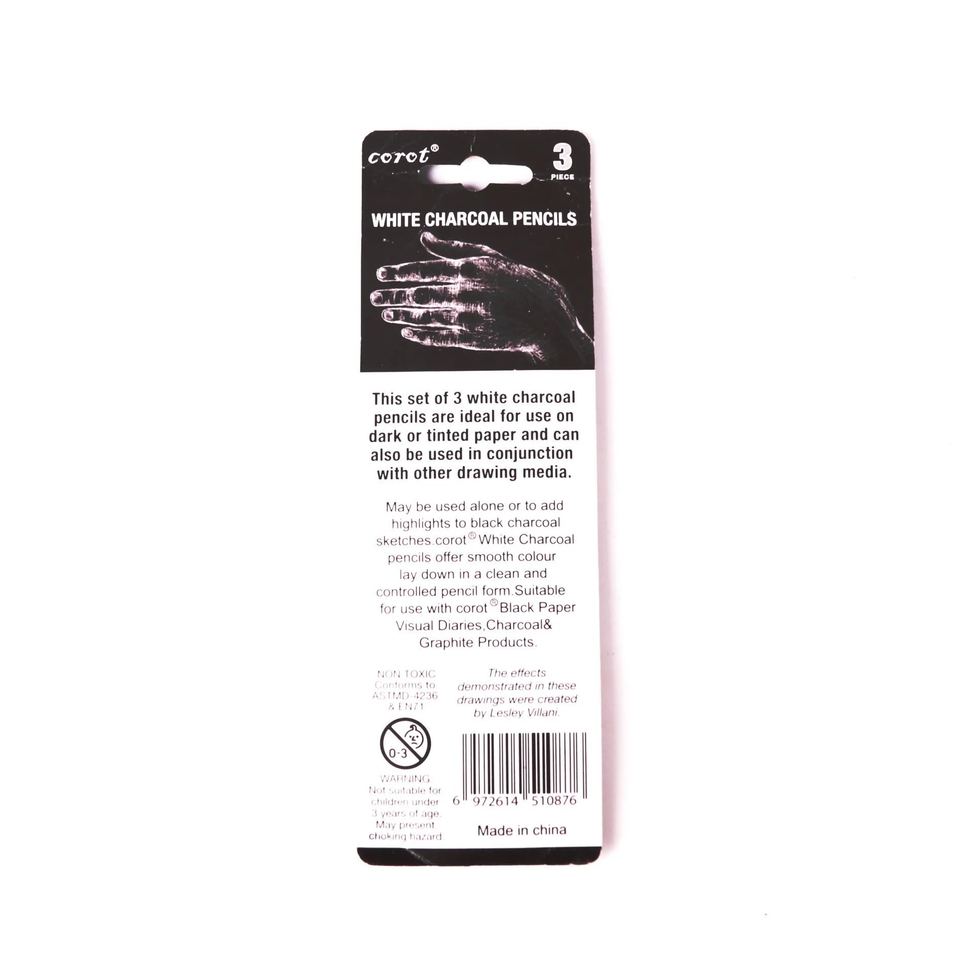 Three white charcoal sketching pencils with wooden casings and a visible refillable brush tip.